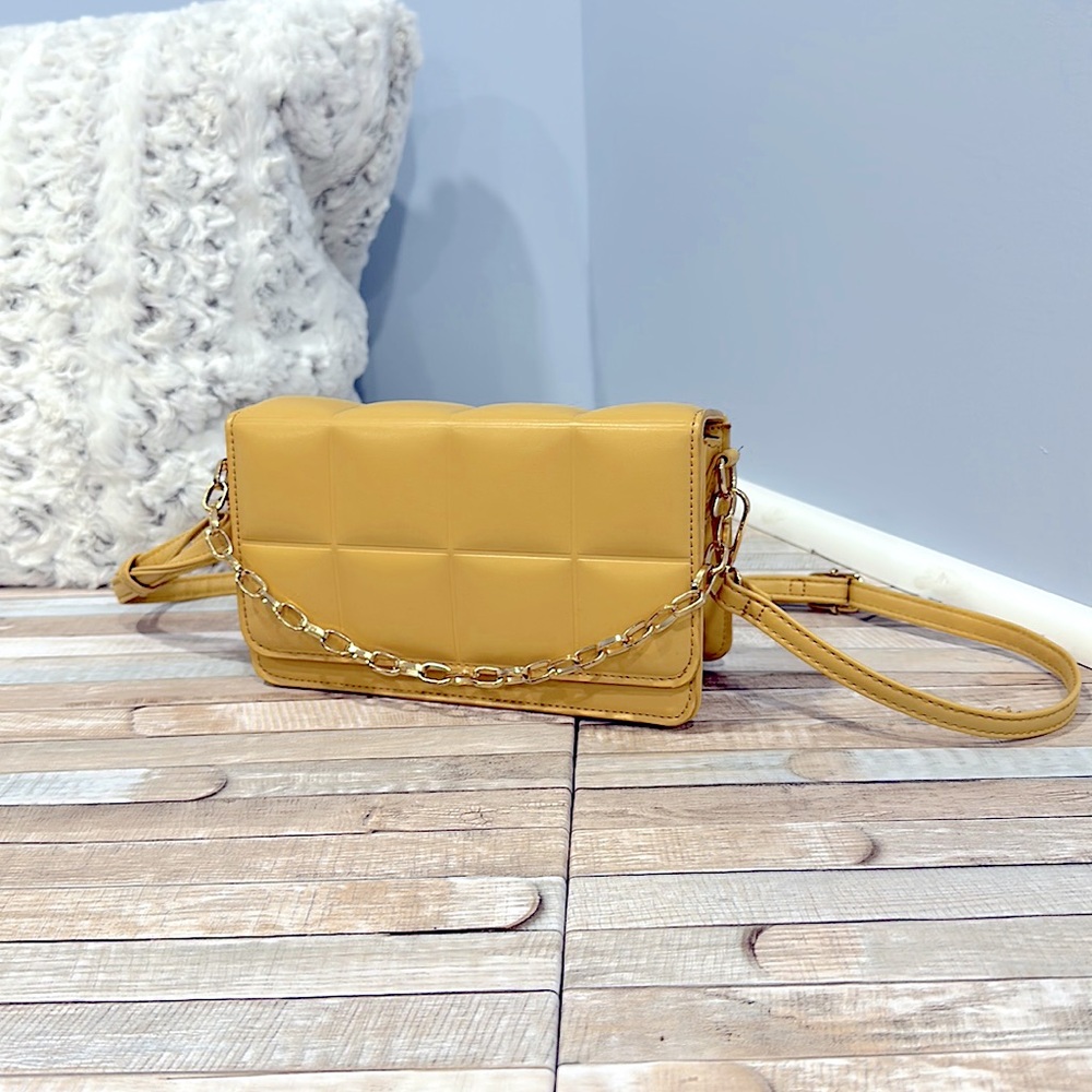 Buttercream yellow Nordstrom rack purse with adjustable straps and gold hardware